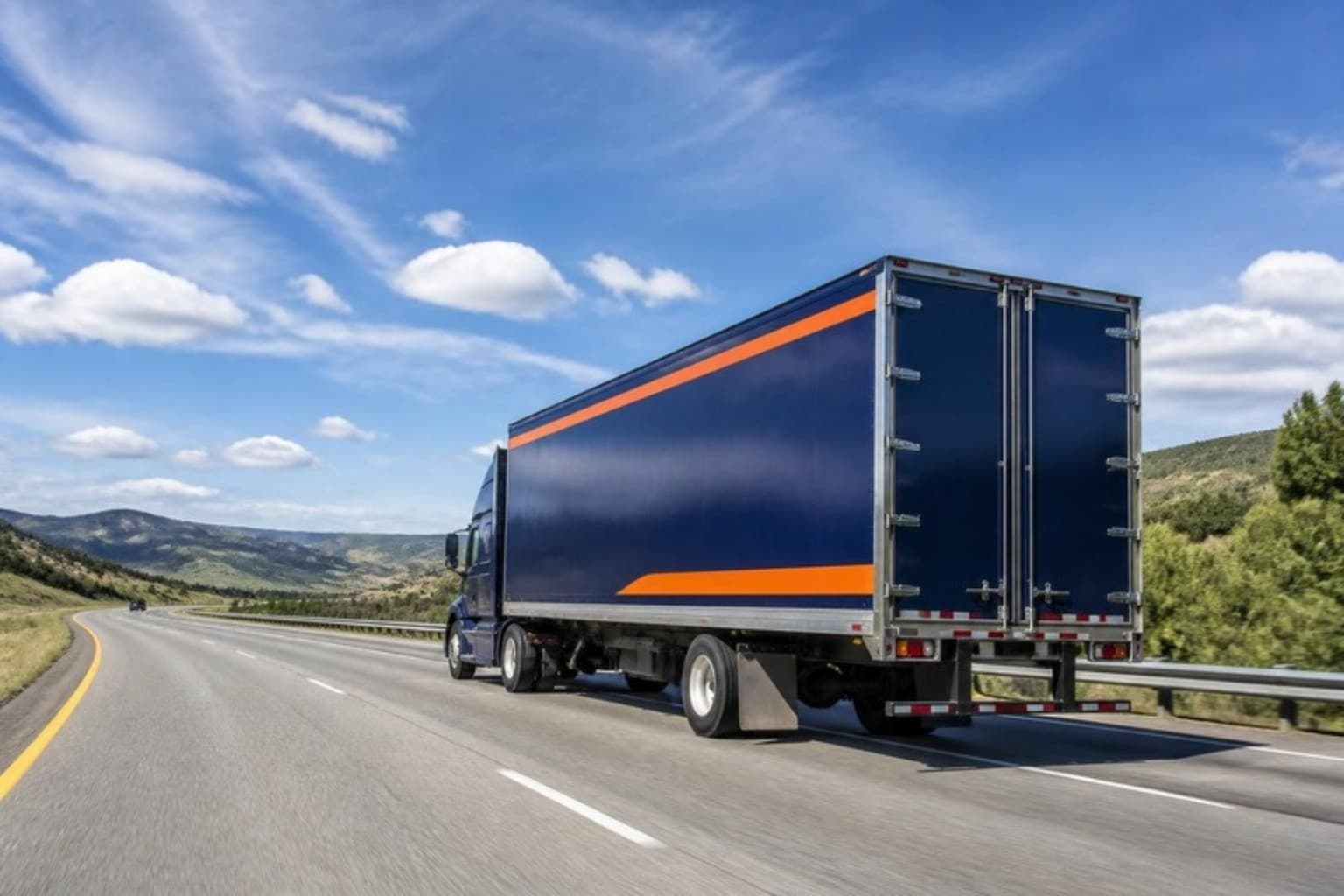 Logic Moving truck cruising along an interstate highway